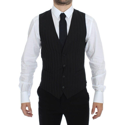 Dolce Gabbana striped dress vest worn by a model with a white shirt and black tie, showcasing elegant fashion.