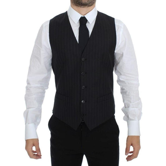 Dolce & Gabbana black striped dress vest worn by model, showcasing front view and adjustable waist strap.