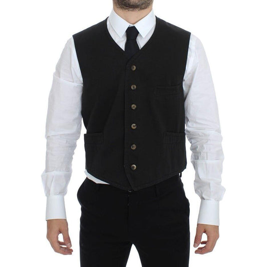 Dolce Gabbana black dress vest worn by a model, featuring adjustable back strap and front button closure.