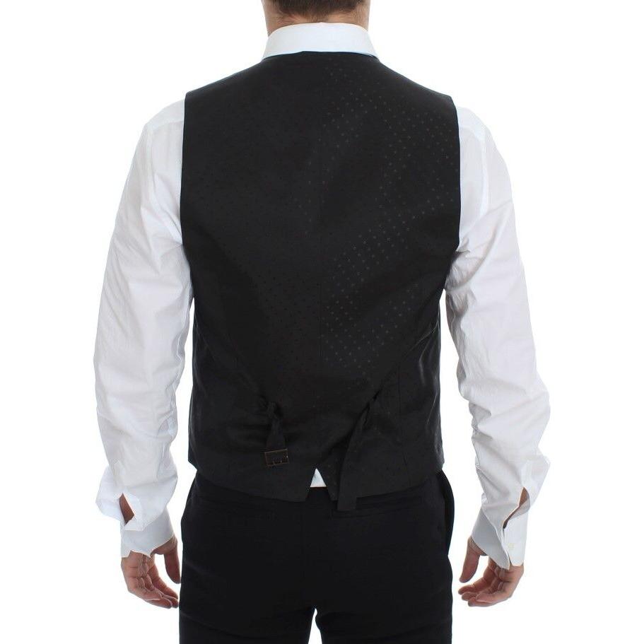 Back view of a man wearing a Dolce & Gabbana black silk wool vest blazer with adjustable straps.