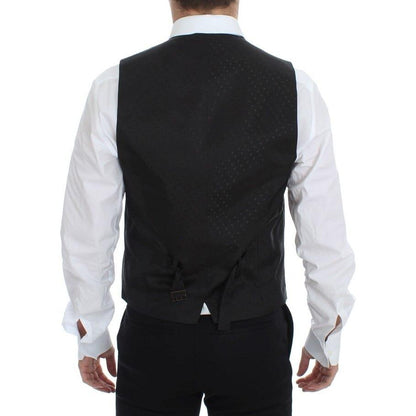 Back view of a man wearing a Dolce & Gabbana black silk wool vest blazer with adjustable straps.