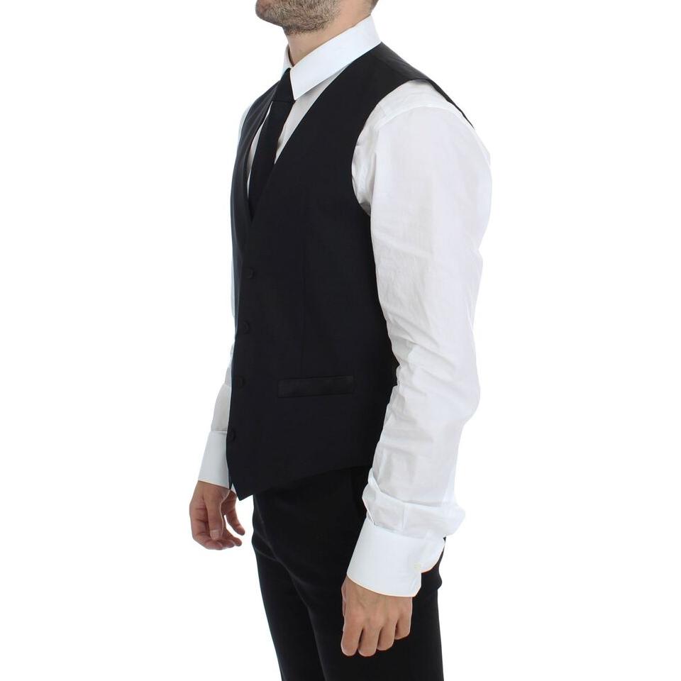 Dolce & Gabbana black silk wool vest blazer worn by a man in formal attire, showcasing a stylish side view.