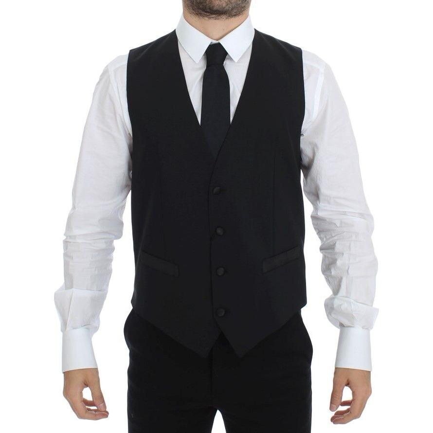 Dolce & Gabbana black silk wool vest blazer worn by a man, featuring a single breasted design and adjustable back waist strap.