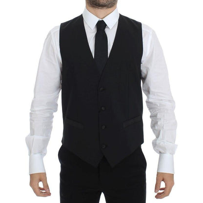 Dolce & Gabbana black silk wool vest blazer worn by a man, featuring a single breasted design and adjustable back waist strap.