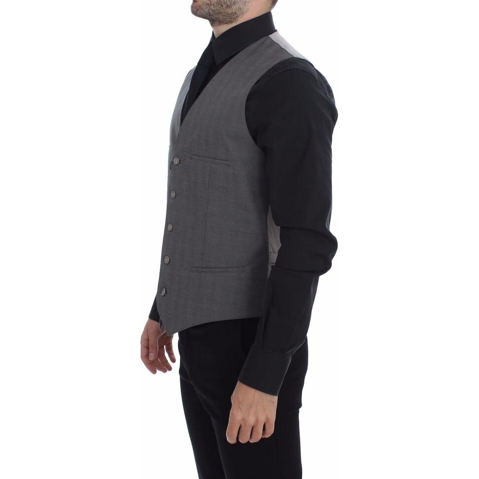 Gray cotton slim fit dress vest displayed on a model, showcasing front button closure and pockets.