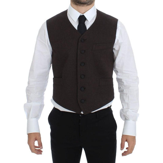 Dolce Gabbana brown dress vest worn by a model with button closure and adjustable back, displaying a sophisticated style.
