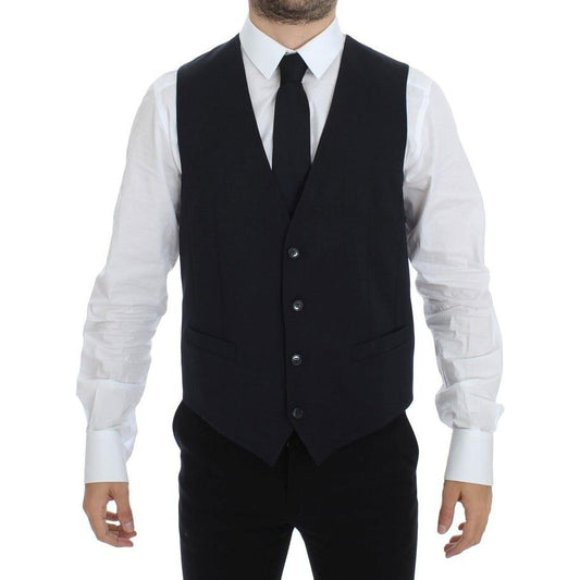 Dolce Gabbana blue cotton dress vest modeled by a man wearing a white shirt and black tie, front view.