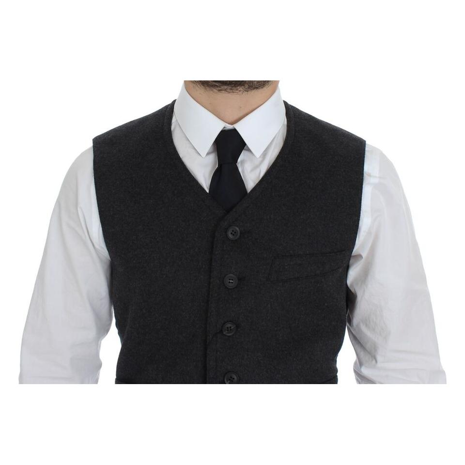 Dolce & Gabbana gray wool blend vest worn with a white shirt and tie, showing front button details.