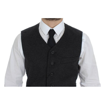 Dolce & Gabbana gray wool blend vest worn with a white shirt and tie, showing front button details.