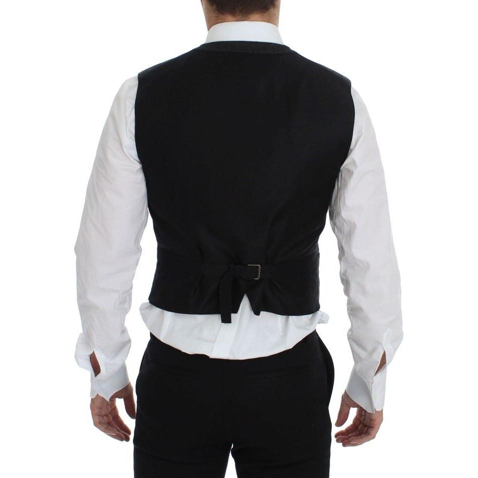 Back view of a man wearing a Dolce & Gabbana gray wool blend vest, featuring adjustable back strap.
