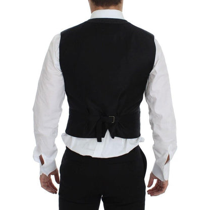 Back view of a man wearing a Dolce & Gabbana gray wool blend vest, featuring adjustable back strap.
